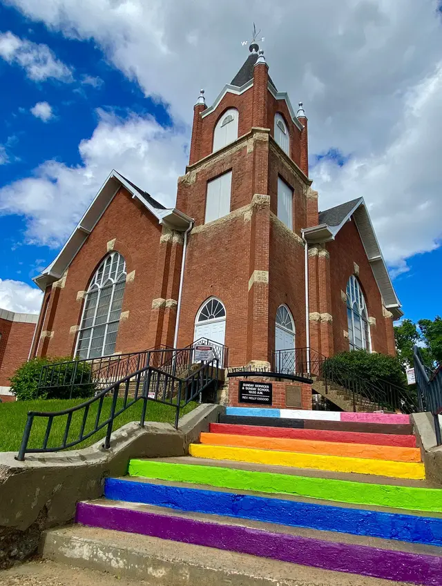 First United Church with rainbow steps